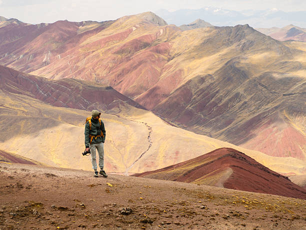 istock Andean red landscape with traveler 2213322713