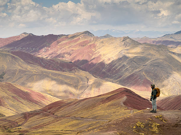 istock Andean red landscape with traveler 2213322715