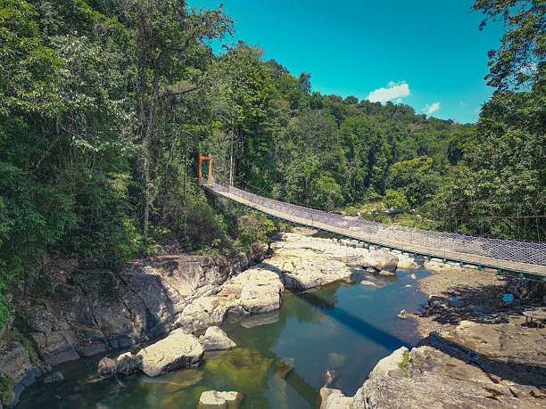 istock cunca wulang waterfall bridge, flores, indonesia 2213324086