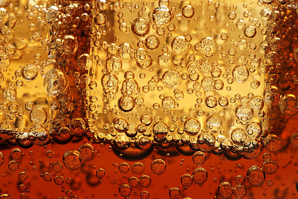 istock Refreshing soda water with ice cubes as background, closeup 2213324824