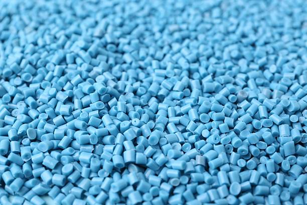 istock Pile of light blue plastic granules as background, closeup 2213324830