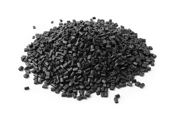 istock Pile of black plastic granules isolated on white 2213324857
