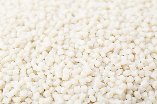 istock Pile of plastic granules as background, closeup 2213324879