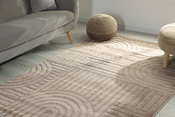 istock Stylish soft rug with pattern on floor in living room 2213325087