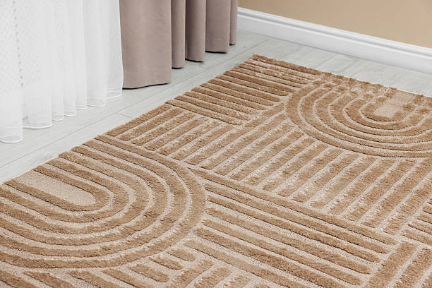 istock Stylish soft rug with pattern on floor indoors, closeup 2213325095