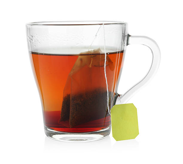 istock Cup with teabag isolated on white. Brewing aromatic tea 2213325107