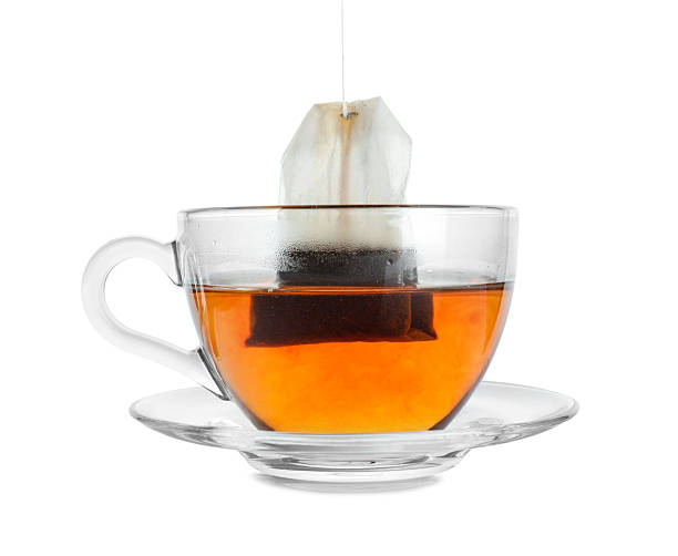 istock Cup with teabag isolated on white. Brewing aromatic tea 2213325126