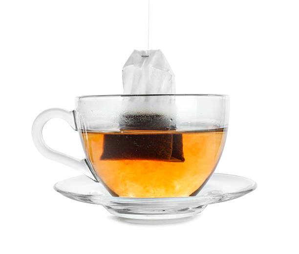 istock Cup with teabag isolated on white. Brewing aromatic tea 2213325135