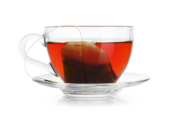 istock Brewing aromatic tea. Cup with teabag isolated on white 2213325147