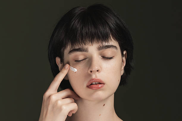 istock Cream on face. Skin moisturizing 2213326872