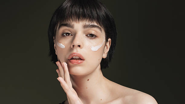 istock Cream on face. Skin moisturizing 2213326881