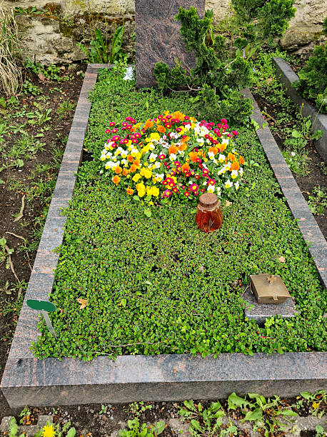 Paris, France: Sunny Clay Flower Detail, Pere Lachaise Cemetery