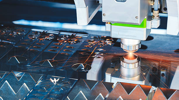 istock Industrial machine laser cutting metal sheets at work, industrial concept background 2213339324