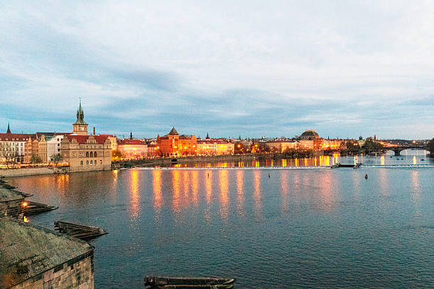 istock Cityscape by Vltava riverbank at dusk 2213343622