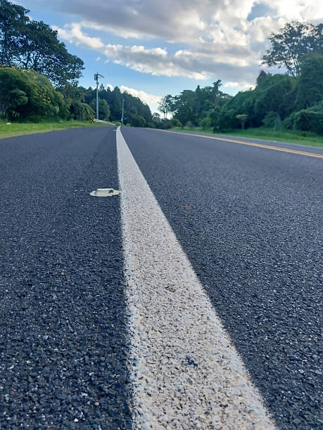 istock Asphalt road in a rural area. 2213354463