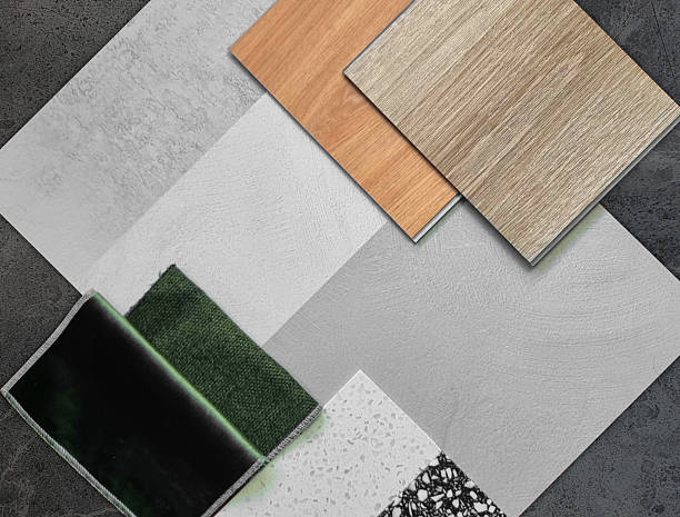istock interior decoration material samples including wooden vinyl tile, concrete laminated, green draperies, artificial stones in close up view placed on black marble. 2213356912