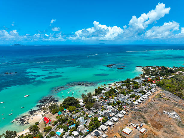 istock Coastal homes by Cap Malheureux reef 2213359973