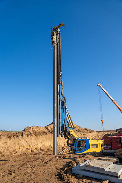 istock The yellow vibrating piling machine removes Larssen sheet piling from the ground 2213362823