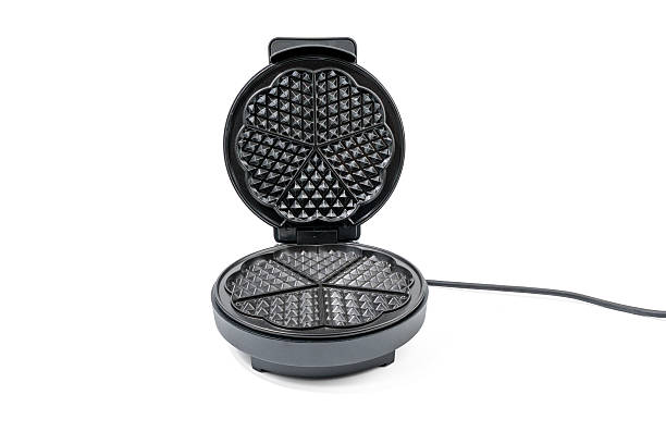 istock A waffle iron is sitting on a white background 2213364955