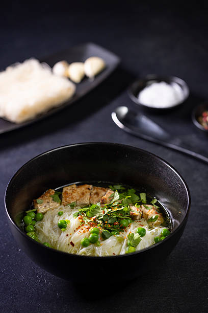 pho soup with duck breast and green peas