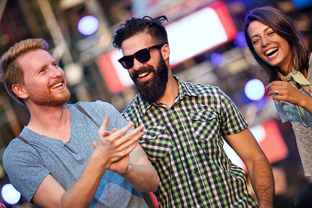 istock Group of friends dancing at a concert. 2213368939