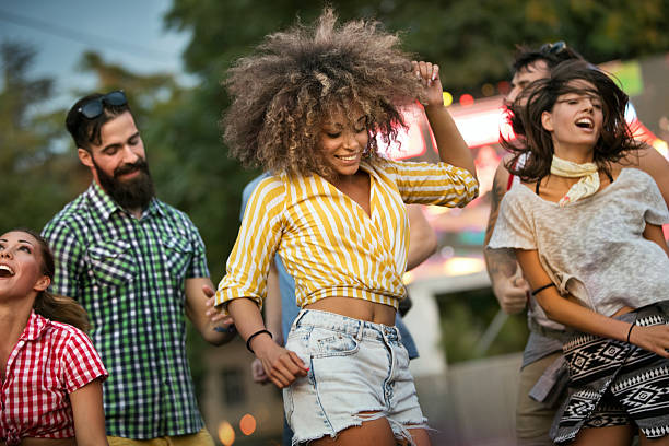 istock Friends dancing at a concert. 2213368960