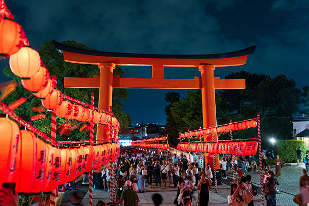 The stage of the Yagura with a big japanese taiko drum Odaiko. Paper red-white lanterns Chochin Scenery for the holiday Obon when people dance of Bon Odori