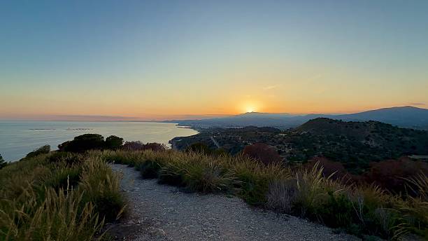 istock A Stunning, Vibrant Sunset Over the Coastal Horizon Featuring a Beautiful Pathway 2213370608