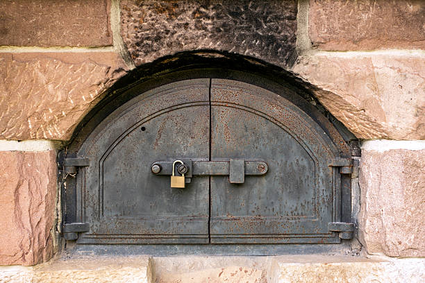 Rusty old metal doors of an oven