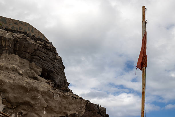 istock Rock and a red wave, cloudy sky, Gran Canaria, Spain 2213377267