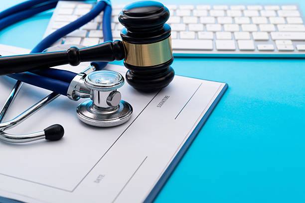 istock Gavel and stethoscope on blue background 2213378264