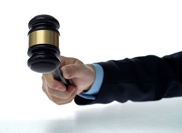 istock Human hand holding wooden gavel 2213378379