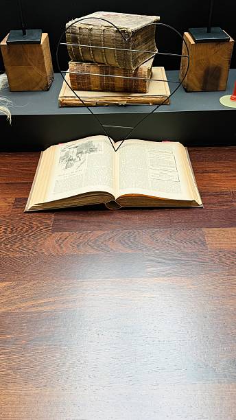 istock In a library, Working with a book from 1892 2213378395