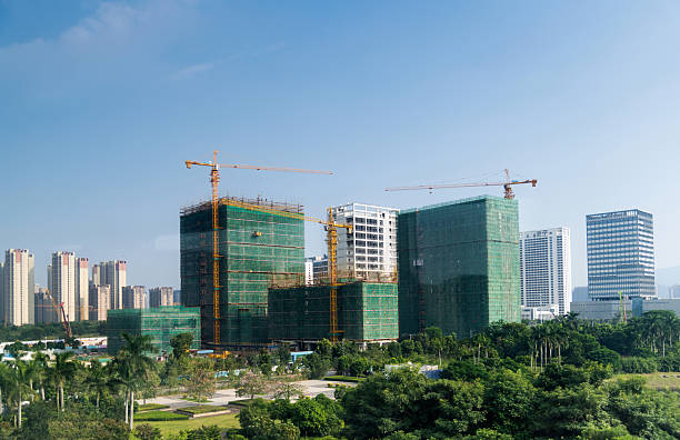 Modern city buildings under construction.