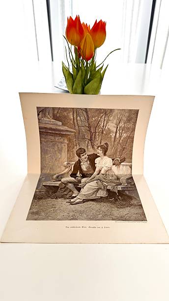 In a library, Working with an illustration from 1892, couple on a bench short before the yes for marriage