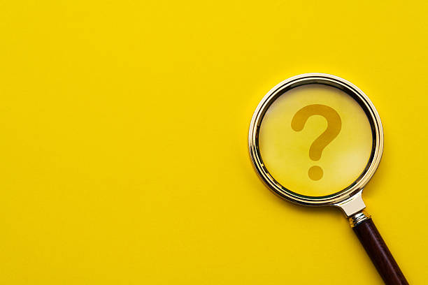 istock Magnifying glass in front of question mark 2213378733