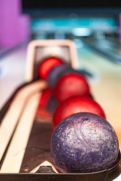 istock Bowling balls ready on the return machine at the bowling alley 2213379941