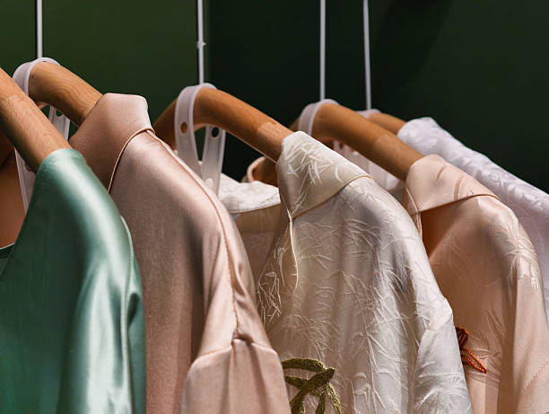 istock clothes hanging on hangers 2213380389