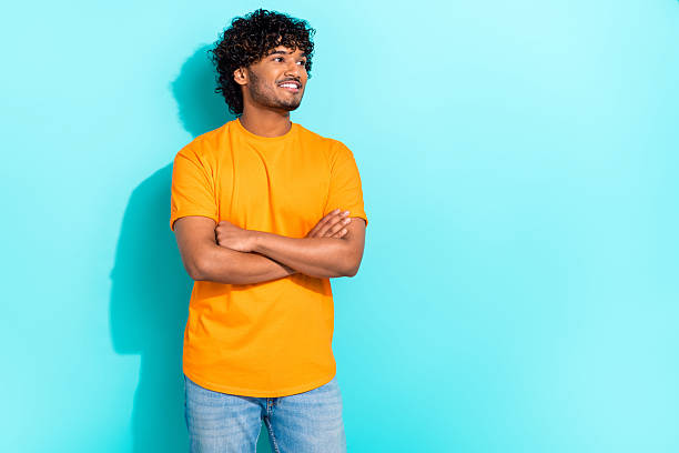 istock Photo of cheerful nice creative young man folded hands beaming smile look interested empty space isolated on teal color background 2213380490