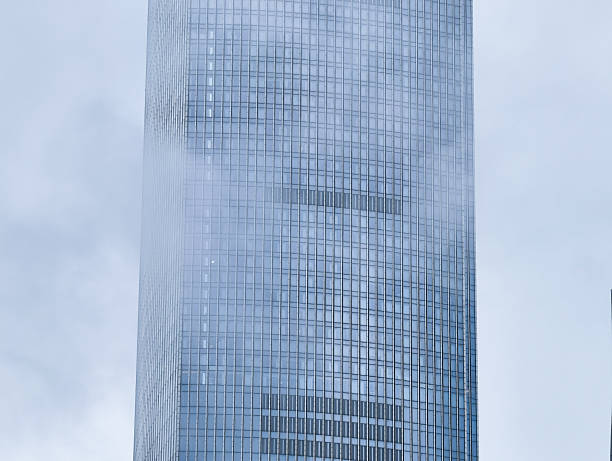 istock modern office building with fog 2213380777