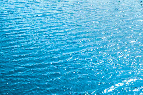 istock Sea surface. Light Blue water texture or close up light  blue water surface at deep ocean 2213380792