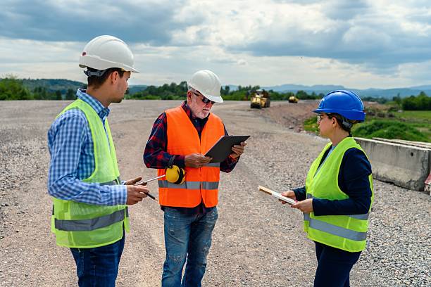 istock Engineers and investor on a road construction site 2213382279