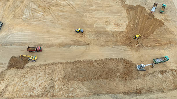 istock Aerial View of Construction Site with Heavy Machinery 2213384216