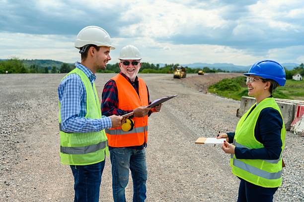istock Engineers and investor on a road construction site 2213384340