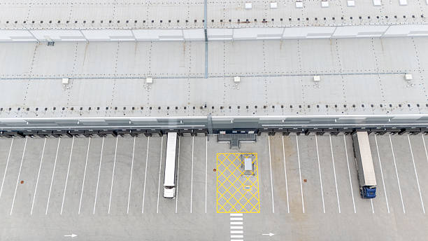 istock Aerial View of Industrial Warehouse with Loading Docks 2213384428