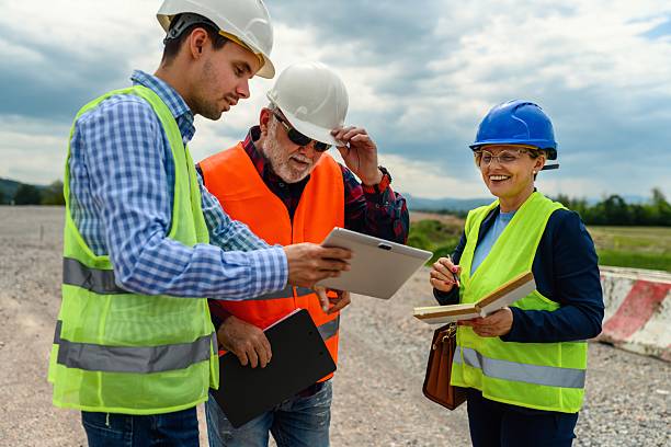 istock Engineers and investor on a road construction site 2213389521