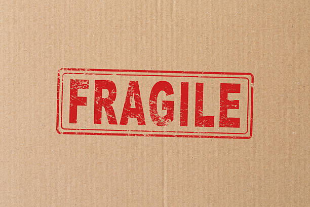 istock Fragile stamp icon vector red or breakable glass shipping sticker seal tag for mail parcel packages grunge labels graphic isolated on white clipart image 2213397898