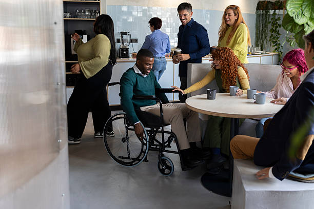 istock Diverse business team enjoying coffee break in modern coworking space 2213399501