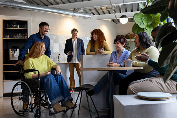 istock Diverse business team enjoying coffee break in modern coworking space 2213399618