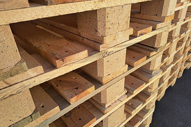 istock Stack of wooden pallets in warehouse. Organized bulk layout for storage. Industrial background with cargo transport texture. 2213399671